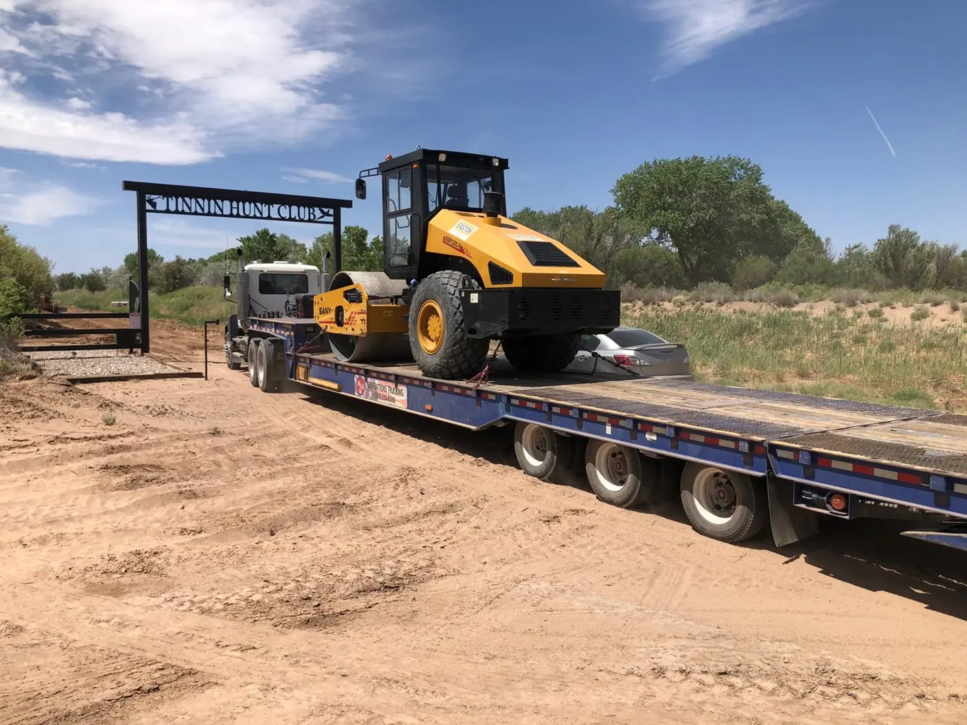 Roller delivered on a lowboy at the ranch entry